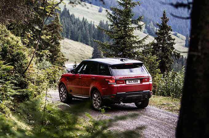 Range Rover Sport in woods.