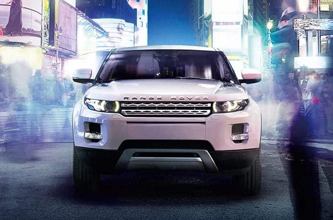 Range Rover Evoque in city nightlife.