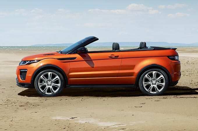 Orange Range Rover Evoque Convertible in beach.