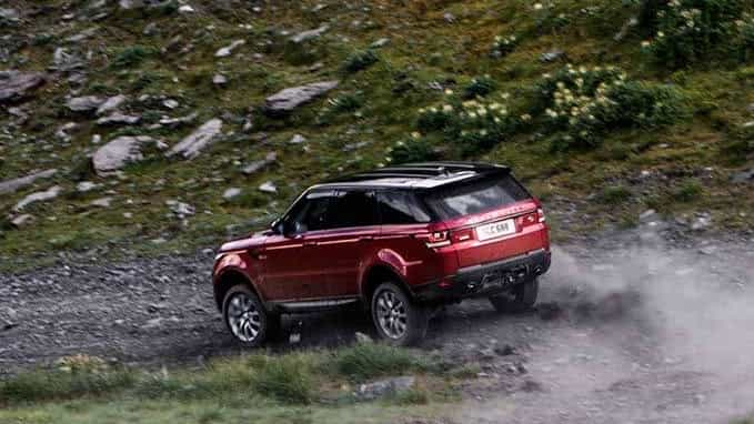 Red Range Rover dirt road