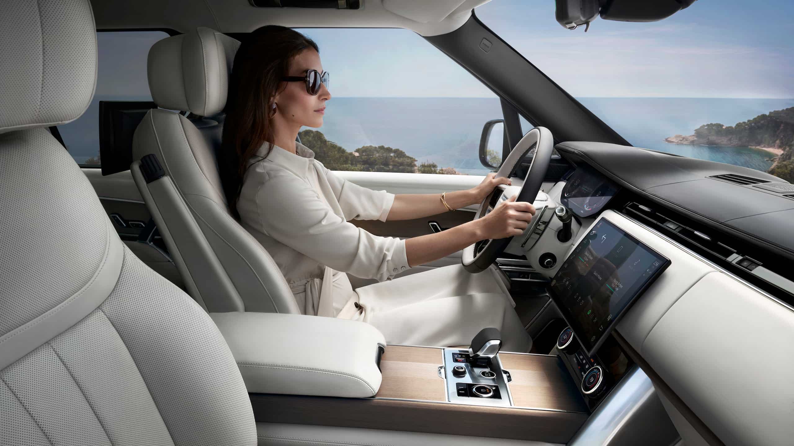 Interior view a women driving Range Rover 